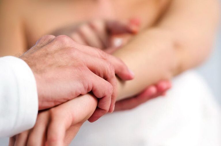 Dermatologist examining a patient with psoriasis